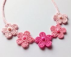 "This minimalistic crochet necklace is made of 100% cotton.  Color: gradient pink (flowers). Five flowers are decorated with matching beads.  Closure - ties (14\" on each side).  Suitable for all seasons, different styles of clothing.  If you have any questions about this item, please feel free to contact me.  Thank you for visiting !" Pink Crochet Bohemian Necklace, Pink Crochet Necklace, Bohemian Pink Necklaces With Handmade Flowers, Cute Pink Necklace For Spring, Cute Pink Necklaces For Spring, Cute Pink Flower-shaped Necklace, Cute Pink Flower Shaped Necklace, Handmade Pink Necklaces For Spring, Adjustable Pink Crochet Jewelry