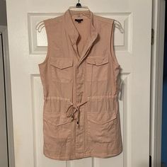 Nwt A.N.A. Sleeveless Cargo Shirt. Rose Smoke In Color. Drawstring Belted Waistband With Silver Accents On Lace. 4 Front Cargo Pockets. Hidden Button Front Closure. 100% Lycocell Material. Size X Small. Pink Sleeveless Vest With Pockets, Spring Sleeveless Blouse With Pockets, Spring Sleeveless Blouse Tank Top With Pockets, Casual Sleeveless Tops With Pockets, Cargo Shirts, Silver Accents, Shirt Color, Colorful Shirts, Button Down Shirt