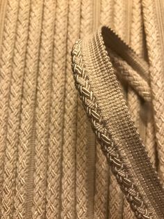 a close up view of a zipper on a bed