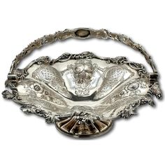 an ornate silver bowl on a white background