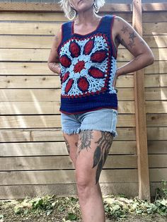 Holy crap this is amazing and special  1970's handmade crocheted tank top  Blue, light blue and red colors  Great pattern and design  Tank sleeves and scoop down pretty low so your bra will definitely hang out  That doesn't bother me but it may to some so it's to be noted  It's in amazing condition  Fits a medium/smaller large there is a little stretch to the yarn  Measurements are approximate and taken flat so please double bust and waist for more accurate sizing  Bust: 17.5 in  Waist: 16 in  L Vintage Handmade Tops For Summer, Handmade Vintage Tops For Summer, Handmade Vintage Summer Tops, Sleeveless Granny Square Tops For Spring, Blue Casual Tank Top For Festival, Casual Blue Tank Top For Festivals, Bohemian Patchwork Tank Top For Summer, Casual Sleeveless Granny Square Top, Bohemian Blue Tank Top For Beach