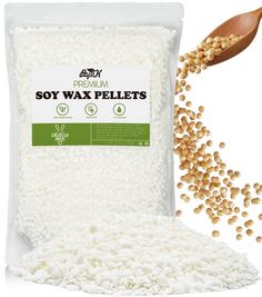 soy wax pellets in a bag next to a wooden spoon