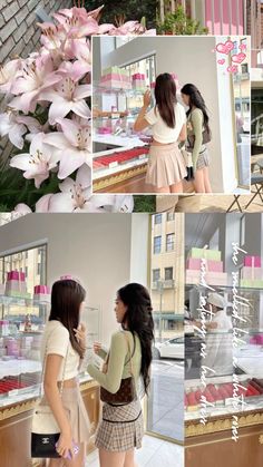 two women are standing in front of a store window and one is looking at her phone