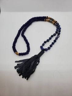 Vintage Marisa Mason glass bead and Lapis tassel necklace The necklace is absolutely stunning is made of cobalt blue glass beads hand carved lapis stone and a beautiful leather tassel it's in remarkable condition and is approximately 36 in Long Bohemian Lapis Lazuli Beaded Necklace With Adjustable Fit, Elegant Blue Tassel Necklace As Gift, Handmade Blue Tassel Necklace With Round Beads, Spiritual Tassel Necklaces With Adjustable Fit, Blue Tassel Necklace As Gift, Elegant Blue Tassel Necklace Gift, Blue Tassel Necklace With Round Beads For Gift, Elegant Adjustable Lapis Lazuli Beaded Necklace, Adjustable Blue Tassel Necklace For Gift