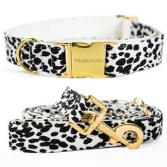 the black and white leopard print dog collar is shown with gold hardwares on it