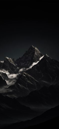 the mountains are covered in clouds at night