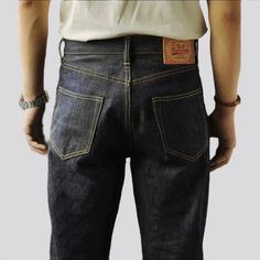 Make a lasting impression and take your style game up a notch with our 2023 Autumn Collection Selvedge Jeans. Crafted from unsanforized, 14oz heavyweight denim for a unique, vintage look, these high-waist, raw, and straight jeans will have all eyes on you. Transform your wardrobe with these distinctive features: Raw & Straight: Show off your bold spirit with a rugged, straight hem and raw edges. High-Waist: Embrace the timelessness of high-waisted jeans with an effortless fit. Unsanforized Fabri Selvedge Denim Blue Jeans For Streetwear, Everyday Selvedge Denim Pants, Urban Selvedge Straight Leg Jeans, Selvedge Straight Leg Jeans For Streetwear, Selvedge Straight Fit Jeans With Standard Cut Leg, Urban Dark Wash Selvedge Jeans, Classic Jeans With Contrast Stitching, Classic Denim Jeans For Streetwear, Selvedge Jeans For Everyday