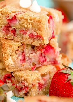 strawberry shortcakes stacked on top of each other next to strawberries and marshmallows