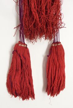 "Black Yao back adornments, from different subgroups like the Iu Mien living in Laos and Thailand. It is made with long red cotton streamers which hang on the back of the tunic collars. The top is made with old decorated silver bells and glass beads. Two big tassels hang on each side. Traditionally a dark burgundy red is used. The most recent ones used a much brighter red, and are from end XXth, like this example, probably from the 70s' or 80s'. Dimensions: Length: 49 cm Lenght with big tassels Big Tassels, Middle East Jewelry, Golden Triangle, Hill Tribe Silver, Se Asia, Silver Bells, Ethnic Earrings, Long Red, Burgundy Red