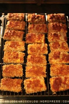 some food is cooking on a grill in the oven and ready to be cooked for consumption