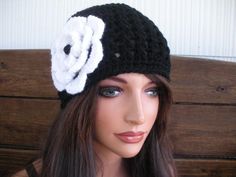 NEW - Winter Fashion Crochet Hat with Flower - Creationsbyellyn. Black crochet hat with white flower - Women / Teen hat - Winter fashion hat. MATERIALS: Acrylic yarn - Black and White yarn Women / Teen size ONE SIZE SIZE: 22 " inches circumference when stretch 4  1/2 "  inches crochet flower Care instructions: Hand wash. Lay flat to dry. Air dry only. Cheap Black Yarn Hats, Cute Winter Hats Lightinthebox, Cheap Black One Size Fits Most Crochet Hat, Cheap Black Crochet Hat, One Size Fits Most, Cheap Black Crochet Hat, Cheap Crochet Winter Cap, Cheap Winter Crochet Cap, Cheap Adjustable Black Crochet Hat, Black Winter Hats For Women