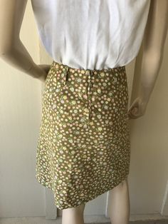 Vintage 1960's Skirt ~ Patty Woodard, California, Olive Green W/ Tiny Pink Flowers, Zips Up The Back With Big & Wide Belt Hoops Belt ~ Great Condition I will be mailing this Priority Mail and First Class International. Measurements Skirt Waist 24 Inch Hips Bone 32 Inch Tush 36 Length 21 Inch Vintage Lined Mini Skirt, Green Retro Cotton Mini Skirt, Vintage Green Mini Skirt, 1960s Miniskirt, Vintage Yellow Lined Skirt, 1960s Skirt, Mesh Gloves, 1940s Hats, Vintage Clip