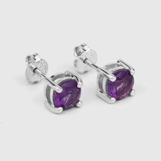 Amethyst Stud Earrings / Natural Amethyst Round Stud Earrings / February Birthstone EarringsFlaunt yourself with these amethyst stud earrings. The natural gemstones have a combined weight of 1.53  carats and are set in .925 sterling silver with rhodium plating. The purple hue of these earrings adds a pop of color to any look!  The understated design and vibrant stones make these perfect for every occasion.amethyst earrings, amethyst silver earrings, amethyst stud earrings, natural amethyst silve Purple Round Pierced Earrings, Purple Amethyst Birthstone Earrings, Round Amethyst Gemstone Earrings, Purple Anniversary Earrings, Purple Amethyst Earrings With Prong Setting, Nickel-free Round Purple Earrings, Purple Birthstone Earrings For Formal Occasions, Formal Purple Birthstone Earrings, Purple Earrings With Prong Setting For Gift