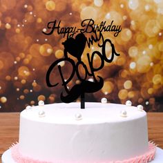 a happy birthday cake with a dog on it's top and the words boo spelled in black