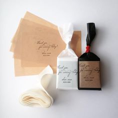 the wedding stationery is laid out on top of each other