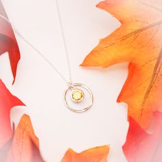 November Birthstone Necklace, November Yellow Topaz Jewelry, November Birthday Gift, November Birthstone Jewelry, Sterling Silver Necklace Lovely November Birthstone Yellow Topaz Necklace. People born in November have two birthstones - Topaz & Citrine. For many designs we use the topaz birthstone, a beautiful amber-colored gem. It symbolizes love and is said to bring strength and increased intellect to the wearer. 💛 A rustic, sterling silver twig ring (20mm in diameter), surrounds a beautif Citrine Birthstone Jewelry With Round Stone, Citrine Birthstone Jewelry, Amber Birthstone Jewelry For Anniversary, Citrine Round Stone Jewelry Gift, Topaz Birthstone Jewelry With Round Stone, Citrine Birthstone Round Pendant, Citrine Birthstone Round Pendant Jewelry, Silver Birthstone Necklace With Gemstone Accents As Gift, Amber Gemstone Necklace For Anniversary