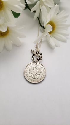 "Celebrate your Polish heritage or honor someone else's with the purchase of this necklace. It features a silver-tone 1995 1 zloty Polish coin and a repurposed white pearl bead or a 1929 coin with a front toggle closure. The coin dangles from a 16\"snake chain with a front toggle closure or an 18\" chain with a 3\" extender. The necklace will make a beautiful birthday gift. Welcome to Recycled Finery!  I repurpose old jewelry, coins, beads, vintage buttons, watch parts, and charms into new jewelry.  My ever-growing collection of these materials comes from estate sales, rummage sales, antique and thrift stores, and family and friends' collections they no longer need or want. I have fun putting these new pieces together and hope that you will find them fun to wear and as unique gifts for you Nickel-free Medallion Necklace For Commemoration, Nickel-free Coin Medallion Necklace Gift, Engraved Coin Necklace For Commemoration, Nickel Free Round Pendant Necklace For Commemoration, Classic Coin Necklace As A Gift, Classic Coin Necklace For Gifting, Classic Coin Necklace For Gift, Classic Medallion Necklace With Coin Pendant As Gift, Anniversary Coin Necklace Nickel Free