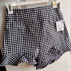 Questions? Leave A Comment Below! Trendy Gingham Shorts, Summer Plaid Bottoms With Ruffles, Casual Ruffled Bottoms For Picnic, Summer Gingham Bottoms With Ruffles, Trendy Gingham High-waisted Shorts, Trendy Gingham Bottoms For Picnic, Fitted Gingham Bottoms With Ruffles, Casual Short Bottoms With Houndstooth Pattern, Chic Plaid Ruffled Bottoms