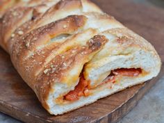 a close up of a sandwich on a cutting board