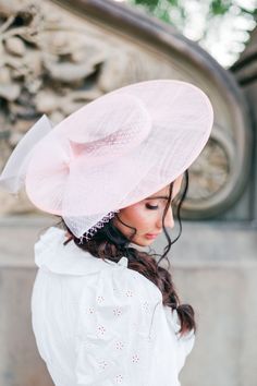 This darling pink fascinator style hat is adorned with birdcage tulle and a pink crinoline bow. It fastens to the head with two silver plated adjustable hair combs. This style also comes in Ivory in separate listing. Elegant Pink Headpiece With Structured Crown, Elegant Pink Headpiece For Royal Ascot, Pink Structured Crown Headpiece For Wedding, Pink Bow Hat For Spring, High Crown Fascinator For Royal Ascot, Feminine Mini Hats For Weddings, Pink Structured Crown Fascinator For Wedding, Pink Feminine Fascinator For Royal Ascot, Pink Feminine Fascinator For Kentucky Derby