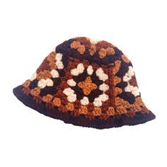 a crocheted brown and white hat with flowers