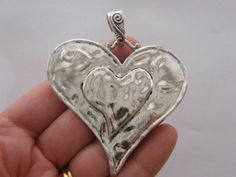 1 Heart pendant 65 x 60mm Lead safe, nickel safe and cadmium safe zinc based alloy Silver Heart Jewelry With Large Pendant, Valentine's Day Silver Jewelry With Large Pendant, Silver Jewelry With Large Pendant For Valentine's Day, Antique Silver Nickel-free Heart Pendant, Antique Silver Heart-shaped Nickel-free Jewelry, Antique Silver Heart Jewelry With Oxidized Finish, Silver Heart Pendant Jewelry With Oxidized Finish, Silver Oxidized Heart Pendant Jewelry, Heart Pendant