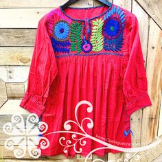 Beautiful shirt with handmade embroider on the neck. You will love the details from top to bottom! Made with 'manta corrugada' a cotton fabric, fresh in summer, cozy in winter. 100% handmade from Chiapas, Mexico. Wide: 25 in Long: 30 in Check additional styles at www.guelaguetzadesigns.com Folk Style Long Sleeve Top With Embroidered Hem, Bohemian Cotton Tops With Embroidered Neckline, Multicolor Long Sleeve Top With Embroidered Sleeves, Festive Embroidered Crew Neck Top, Multicolor Long Sleeve Top With Embroidered Hem, Traditional Tops With Embroidered Sleeves For Summer, Red Cotton Shirt With Floral Embroidery, Bohemian Cotton Top With Embroidered Hem, Red Embroidered Festival Tops