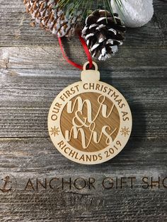 a wooden ornament with the words our first christmas as mr and mrs on it