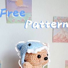 a small teddy bear wearing a blue and white crochet hat with the words free pattern on it