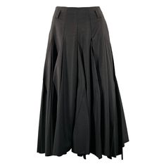 PRADA skirt in a black mohair wool blend fabric featuring a pleated style, belt loops, and side zipper and snap closure. Does not come with belt. Made in Italy.Excellent Pre-Owned Condition. Marked: 38 Measurements: Waist: 26 inches Length: 35.5 inches Sui Generis Reference: 131816 Category: Skirt More Details Brand: PRADA Gender: Female Size: 2 Color: Black Fabric: Mohair / Wool Pattern: Pleated Skirt Length: Long Age Group: Adult Prada Skirt, Pleated Long Skirt, Mohair Wool, Skirt Length, Black Fabric, Long Skirt, Pleated Skirt, Wool Blend, Pencil Skirt