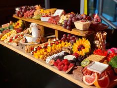 a table topped with lots of different types of foods and fruit on top of it