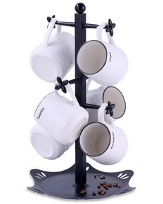 a coffee cup holder with four cups hanging from it's sides and two mugs in the middle