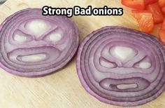 two onions with faces drawn on them are next to carrots and other food items