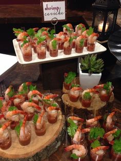 a table topped with lots of food covered in sauces and garnishes