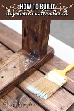 a paintbrush sitting on top of a piece of wood