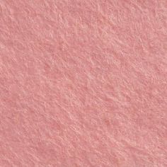 a close up view of pink wool textured material for background or wallpaper design