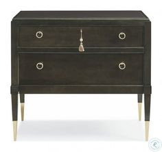 a black dresser with two drawers and brass legs