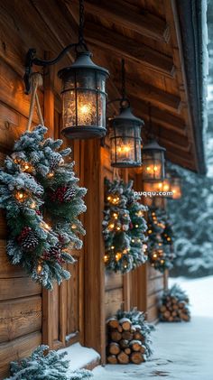 christmas wreaths and lights hanging from the side of a cabin