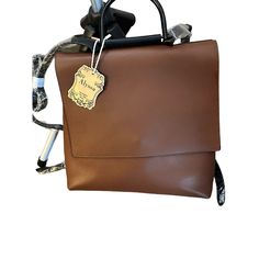 Nwt Alyssa Brown Convertible Vegan Leather Backpack Classic Crossbody Backpack With Detachable Strap, Trendy Rectangular Leather Backpack With Detachable Strap, Classic Shopping Backpack Bag, Classic Leather Crossbody Backpack With Detachable Strap, Versatile Brown Flap Bag For On-the-go, Brown Backpack With Adjustable Strap And Top Handle, Versatile Travel Flap Bag With Detachable Handle, Brown Shoulder Bag Backpack With Top Carry Handle, Brown Backpack With Top Handle