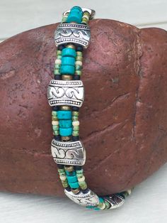 "Mens Turquoise Bracelet, Mens Valentine Gift, Southwest jewelry gift, Mens Turquoise Jewelry, mens beaded bracelet, gifts for him. This is one of my Best Sellers! With genuine turquoise! I've always thought it take a special kind of man to know what kind of jewelry to wear. This is a strong, masculine and expressive piece. It's made of genuine turquoise heishi beads, African brass beads and glass seed beads. Finished off with my favored, double snake spacer beads. It's perfect for the man with Southwestern Turquoise Beaded Bracelets With Spacer Beads, Nickel-free Turquoise Beaded Bracelets, Southwestern Style, Nickel-free Southwestern Turquoise Beaded Bracelets, Rustic Handmade Turquoise Beaded Bracelets, Southwestern Turquoise Nickel Free Beaded Bracelets, Southwestern Turquoise Nickel-free Beaded Bracelets, Handmade Southwestern Turquoise Beaded Bracelets, Turquoise Jewelry Mens, African Brass Beads