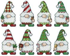 cross stitch christmas gnomes with hats and candy canes on their heads, all in different colors