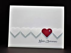 an anniversary card with hearts on it