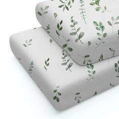 two sheets with green leaves on them