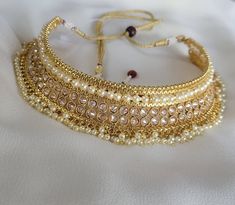 Check out this item in my Etsy shop https://www.etsy.com/listing/1256635982/gold-polki-choker-necklace-jhumka Bollywood Style Gold Choker Necklace, Adjustable Kundan Temple Jewelry Necklace For Diwali, Adjustable Kundan Necklace For Diwali, Adjustable Temple Jewelry Kundan Necklace For Diwali, Traditional Adjustable Jewelry For Eid, Gold Jewelry With Stone Work For Navratri, Bollywood Style Gold Jewelry For Navratri, Adjustable Elegant Necklaces For Diwali, Elegant Adjustable Necklaces For Diwali