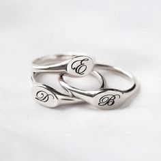 Our stunning oval signet ring is the perfect addition to any jewelry collection, with an unqiue engraving that brings a personal touch to this timeless piece. Sterling Silver Hypoallergenic, lead and nickel free Made in NYC Side Oval width 8mm x Height 5mm Band Thickness 2mm #R009-S Elegant Hand Stamped Engraved Ring As A Gift, Minimalist Oval Signet Ring With Engraving Option, Minimalist Oval Sterling Silver Engraved Ring, Elegant Adjustable Signet Ring With Engraving Option, Oval Sterling Silver Signet Ring With Engraving Option, Engraved Sterling Silver Oval Signet Ring, Oval Sterling Silver Engraved Signet Ring, Silver Initial Ring With Oval Shape, Classic Jewelry With Engraved Text