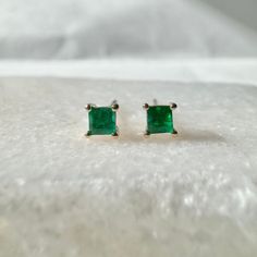 A timeless and elegant design, symbolizing wealth and harmony. Perfect for everyday wear or dressed up for special occasions. Add a pop of color with our Genuine Emerald Princess Cut Stud Earrings, available in 14k solid white gold and 14k solid yellow gold. Item Specifications: Materials: 14k Solid Gold   Gemstone: Natural Emerald Emerald Diameter: 3.7 mm x 3.7 mm Total Gold Weight: 0.58 gram Total Emerald Weight: 0.27 ct Location: Earlobe Closure: Push back  ★  Each order will be beautifully p Princess Cut Stud Earrings, Drawstring Pouch, Natural Emerald, Princess Cut, Jewelry Earrings Studs, Elegant Design, Solid Gold, Jewelry Box, Color Pop