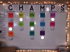 a white board with words and lights on it that say champs in different colors, shapes, and sizes