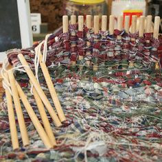 several wooden knitting needles on top of a table