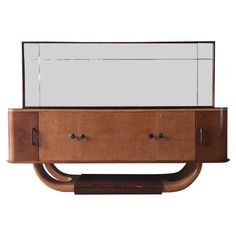 an art deco sideboard with mirrored doors and drawers