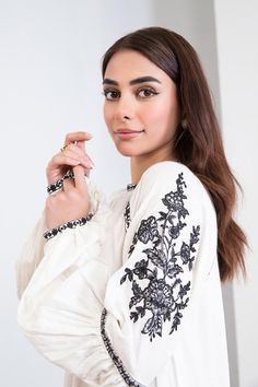 Original Maria B Brand new without tags Description Adding ethereal allure to your everyday look with our embroidered arabic lawn dress adorning the heavenly white canvas with floral embroideries. Details: Dyed shirt, Embroidered Scoop Neckline, Full Sleeves With Embroidery & Motif Detailing Colour: White Fabric: Arabic Lawn Note: Only Dry Clean Model is wearing size xs Disclaimer: Product Color May Vary Slightly Due To Photographic Lighting Or Your Device Settings. Spring Long Sleeve Kurta With Embroidered Cuffs, Spring Kurta With Embroidered Cuffs And Long Sleeves, Cotton Kurta With Embroidered Cuffs, Cotton Kurta With Embroidered Cuffs Long Sleeve, Summer Cotton Kurta With Embroidered Sleeves, White Embroidered Unstitched Kurta, Eid Embroidered Long Sleeve Dress, Eid Long Sleeve Embroidered Dress, White Kurta With Embroidered Sleeves